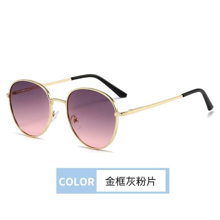 Circular sunglasses inspired by designers - gold framed gray pink lenses, gold designed eyeglass legs. Luxurious details create a high-end appearance.
