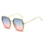 Women's geometric metal frame sunglasses - lightweight UV400 protection. Perfect for street style photography and urban fashion blogging in city environments.