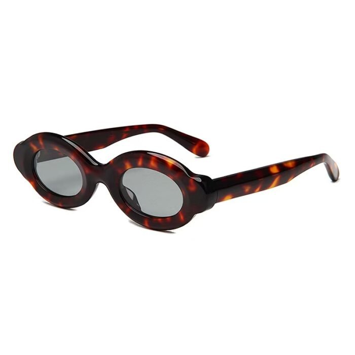Light-responsive oval acetate sunglasses featuring polarized lenses and UV protection, perfect for indoor-outdoor transition.